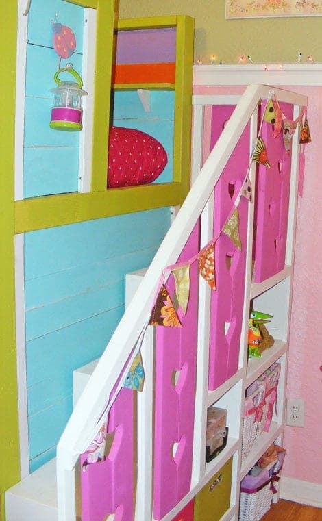 Bunk bed storage staircase with heart-cutout decorative panels and an angled railing