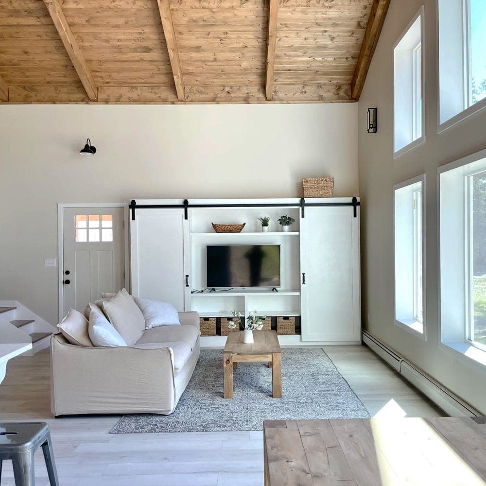 11 foot barn door media wall with two towers and a center console