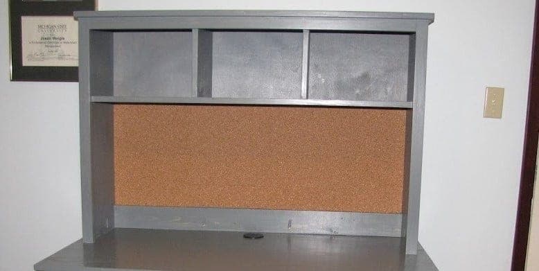 Desktop hutch with open shelf and cubbies and a wainscoting back
