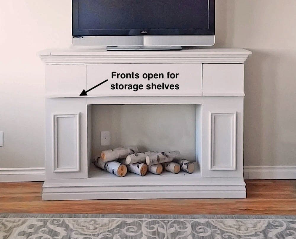 Fireplace-style TV stand with hidden storage behind three doors