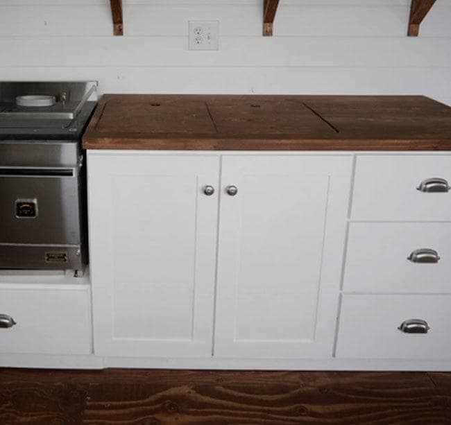 Frameless euro-style kitchen sink base cabinet with concealed hinges