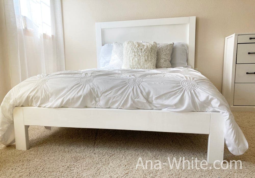 Simple queen bed frame with a plywood-backed headboard and 2x6 siderails