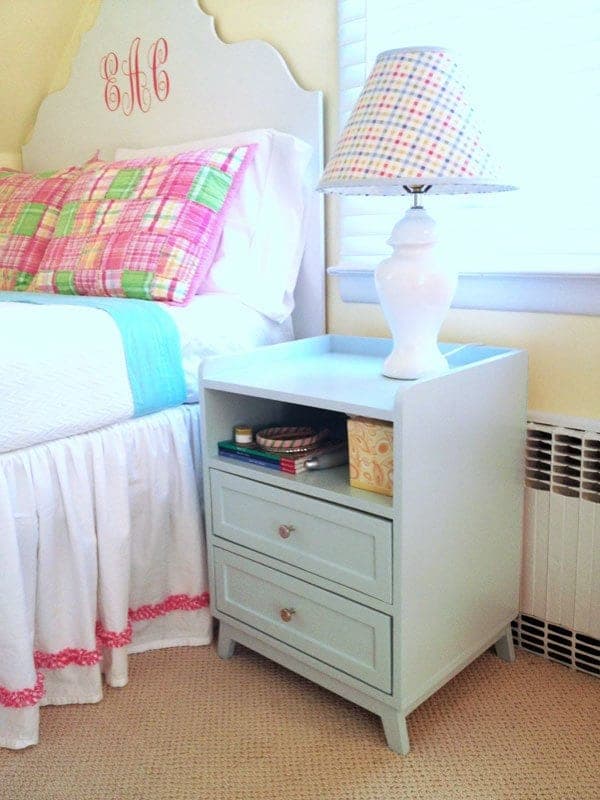 Modern two-drawer nightstand with splayed legs and an open bottom shelf