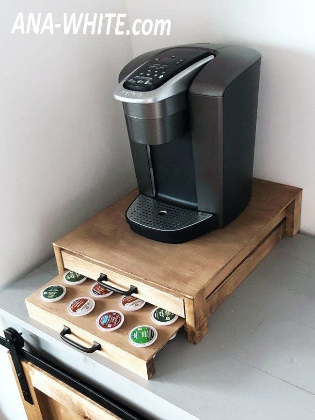 Small wooden crate organizer with a slide-out drilled coffee pod tray