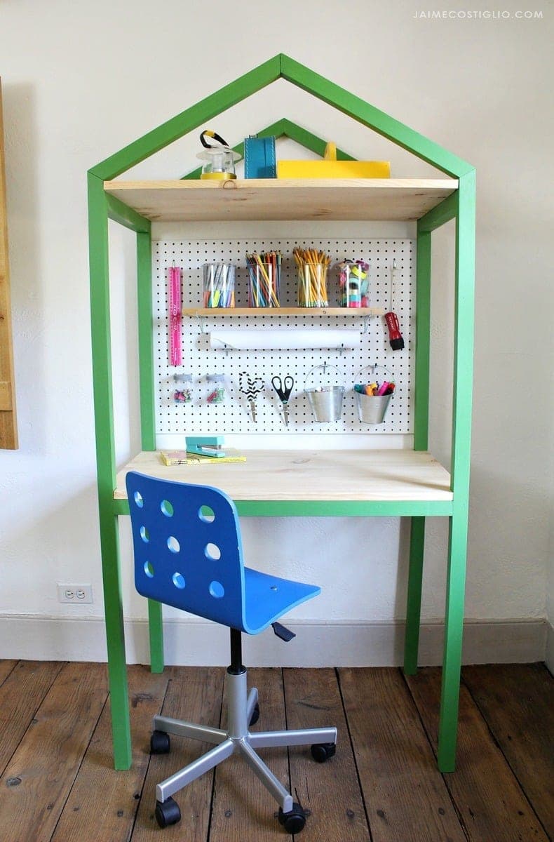 Kids craft desk with a house-shaped peaked frame silhouette