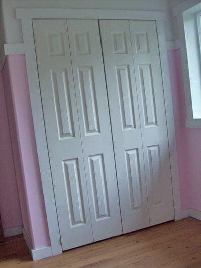 Shallow shelving unit mounted to the back of a closet door
