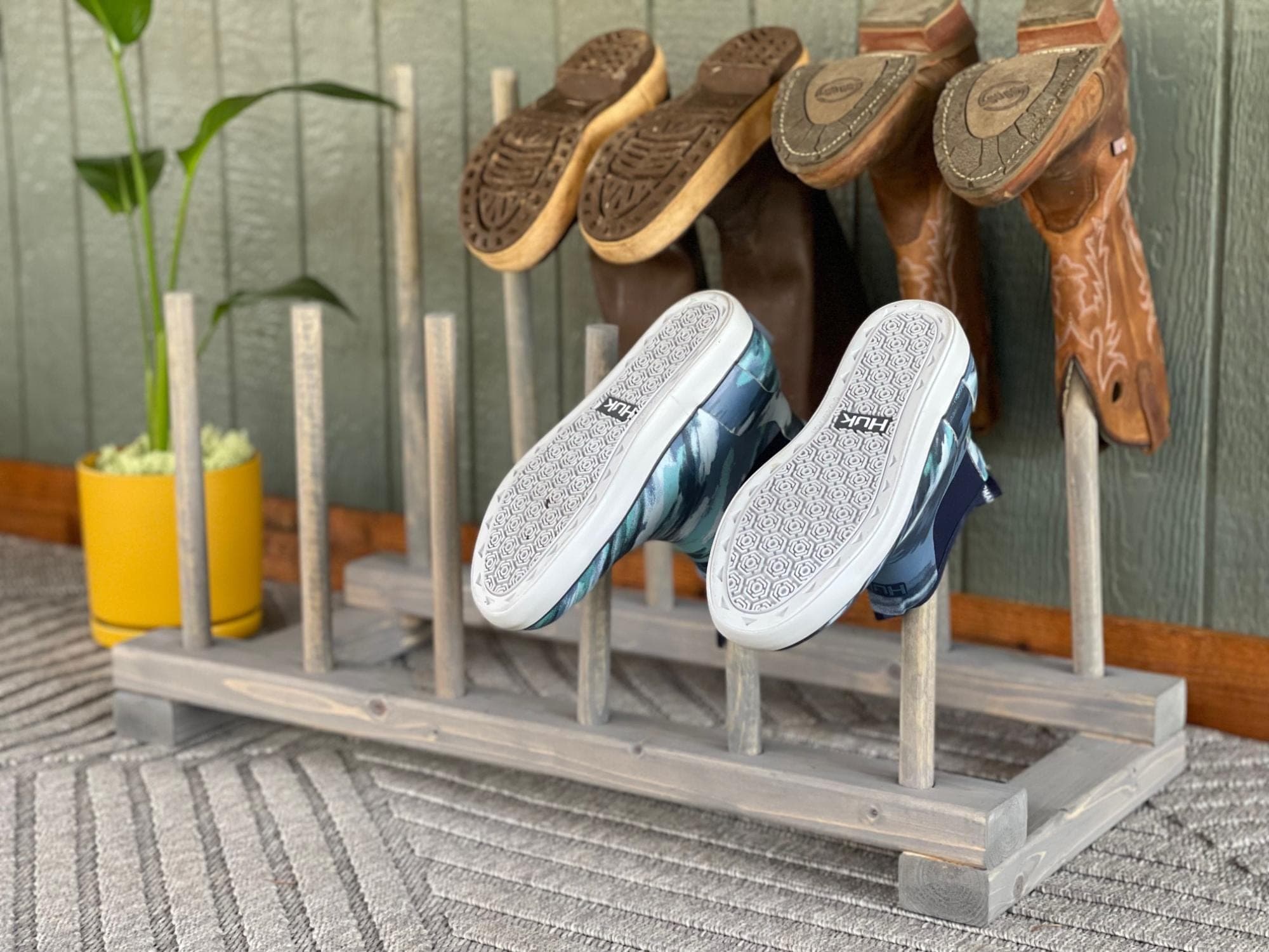 Two-row dowel rack for hanging rubber boots upside down