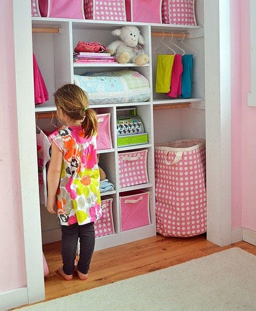 Child-height closet organizer with a hanging rod and adjustable shelves