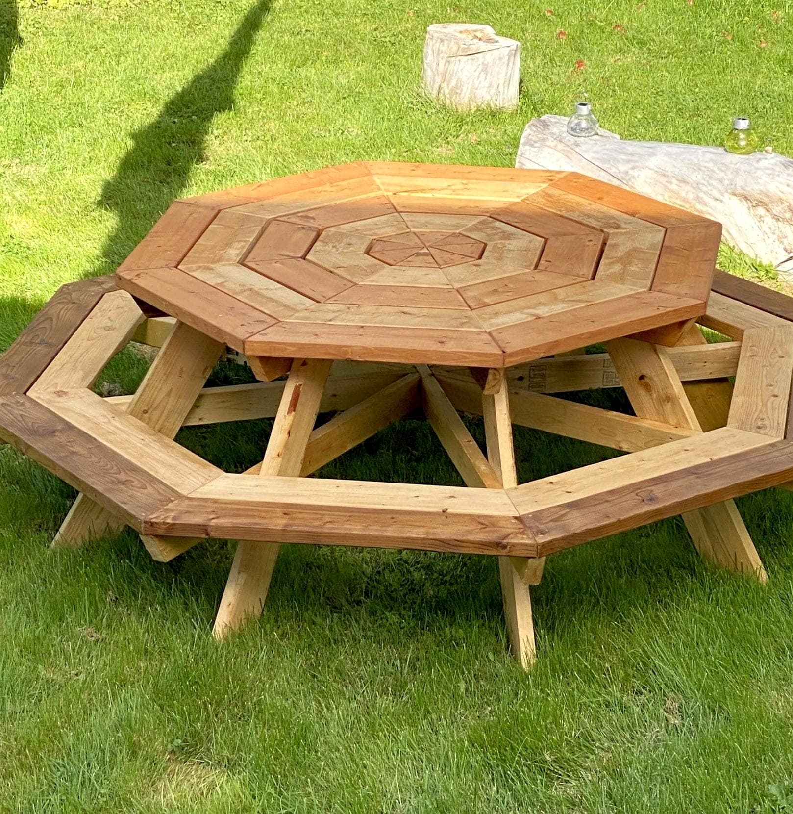 Octagon picnic table built on an X-shaped center frame