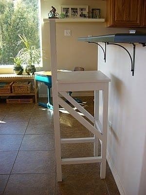 Extra-tall bar stool with a backrest and footrest