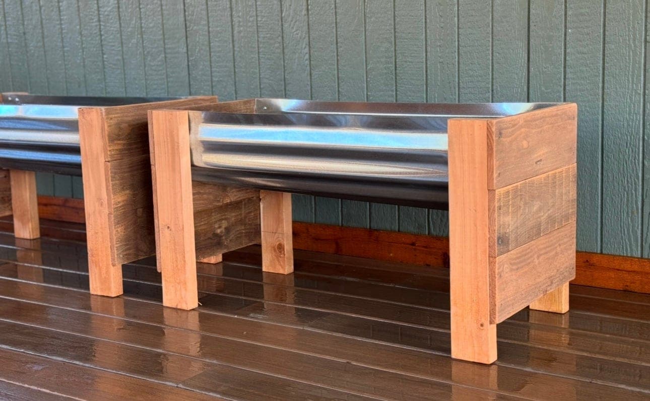 Raised garden planter with corrugated metal sides and cedar ends