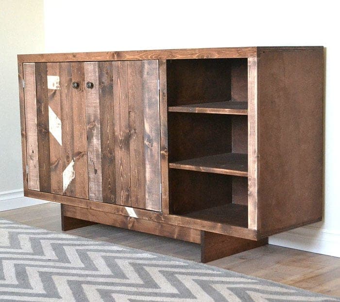 Low midcentury modern buffet cabinet with plank doors and an open center shelf