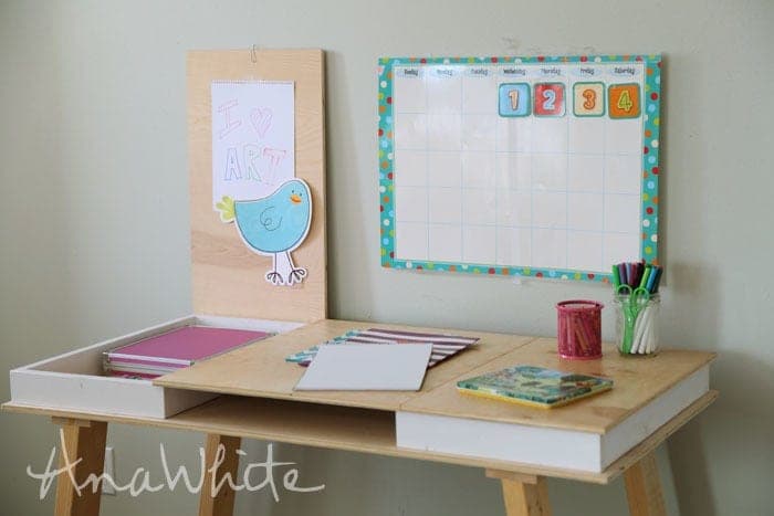 Flat desktop with hinged side panels that lift to reveal hidden storage compartments