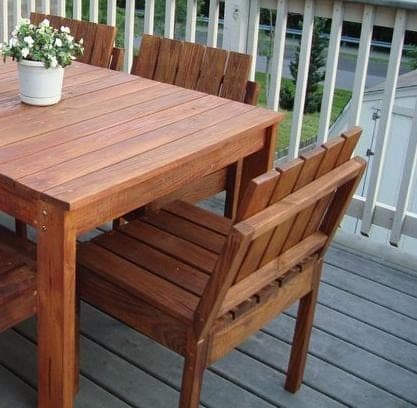 Simple stackable outdoor chairs with slatted seats and backs
