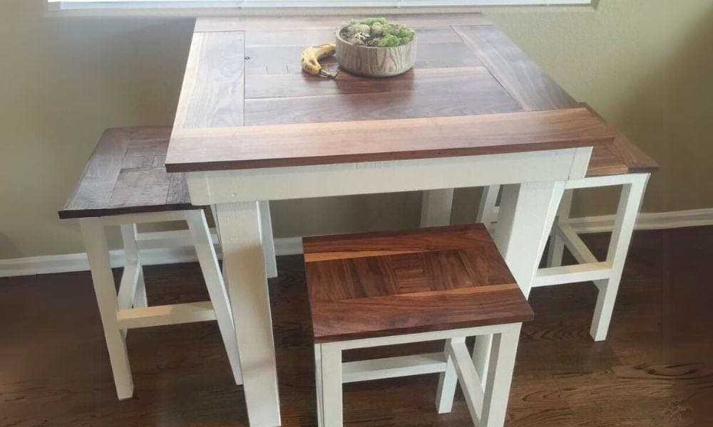 Square pub-height table with a slat top on four 4x4 legs