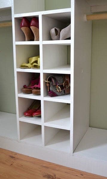 Center-divided shoe cubby insert built into a closet