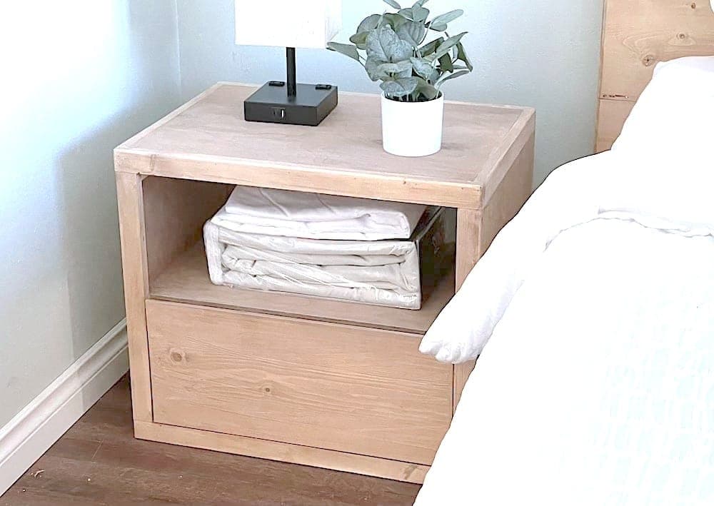 Minimalist modern plywood nightstand with a beveled drawer face
