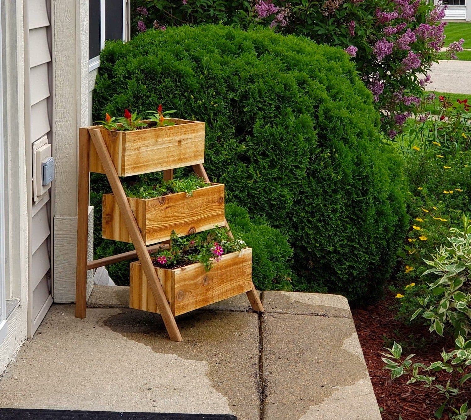 Three-tier cedar planter with stacked boxes on an angled frame