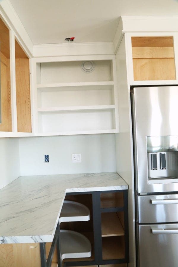 Open wall cabinet with a hardwood face frame and edge-banded shelves