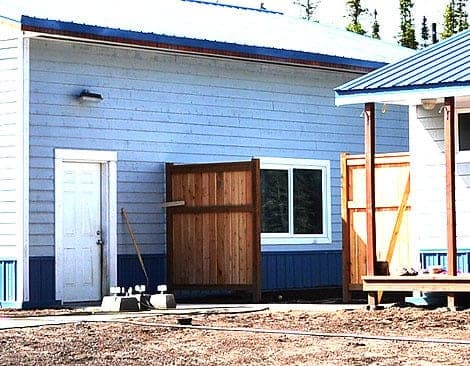 Cedar picket privacy fence section with top and bottom rails
