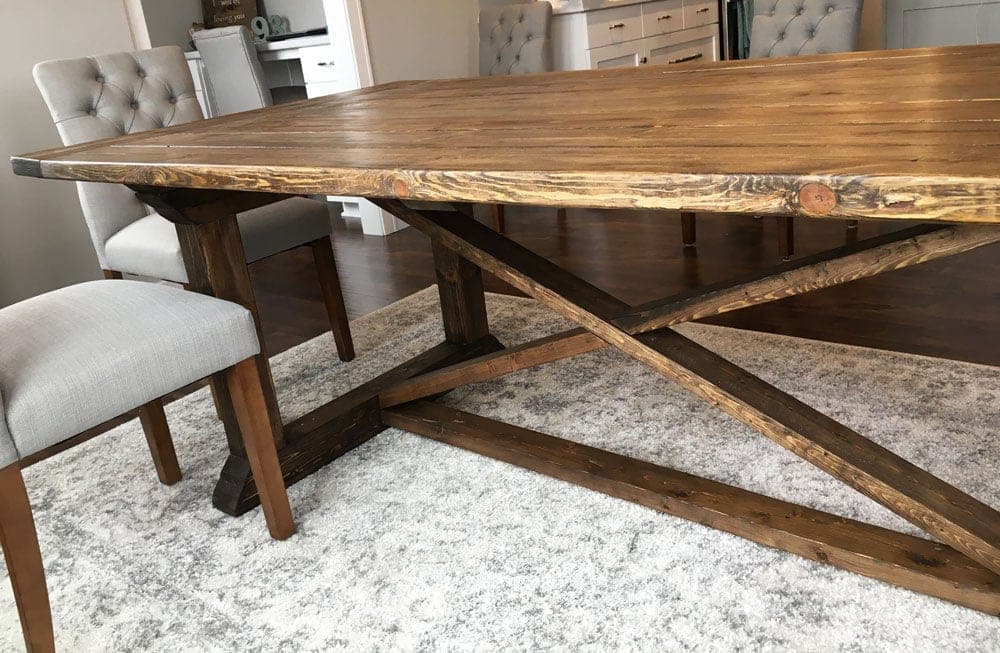 Farmhouse dining table with stacked curved-profile X-brace legs