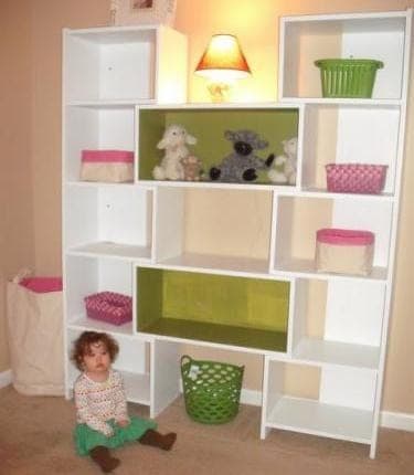 Tall bookcase with staggered shelves and interlocking cubbies