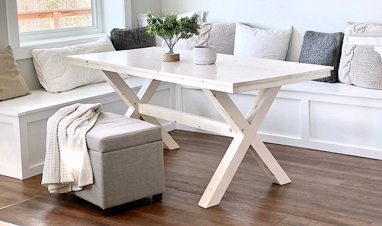 Rectangular dining table on two compound-angle X pedestals