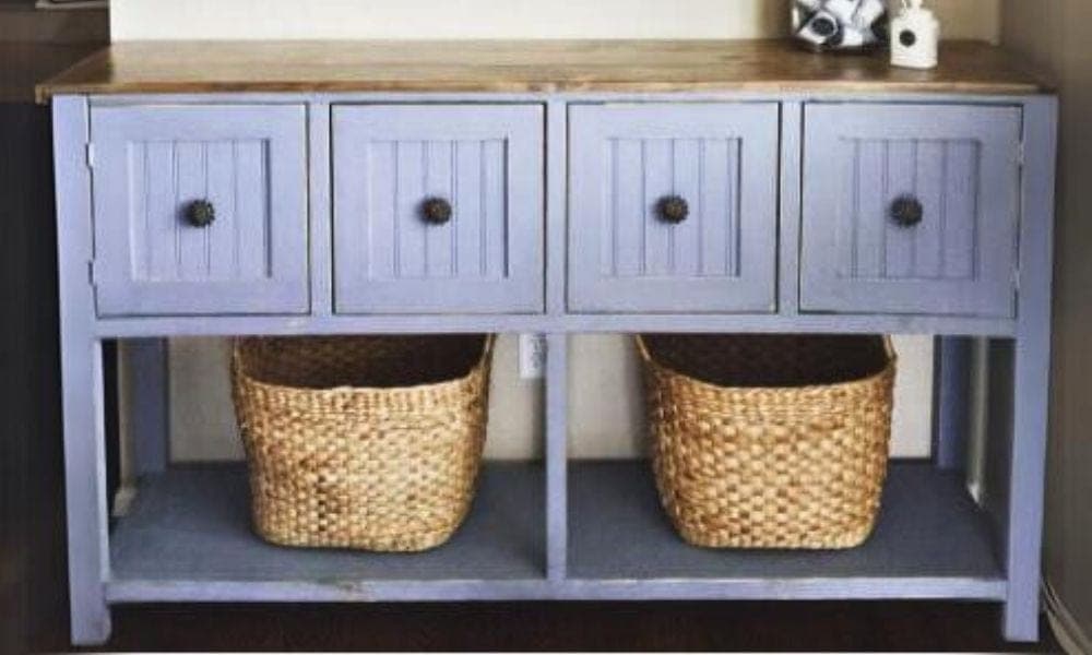 Console table with two drawers, plywood side panels, and a breadboard-end top