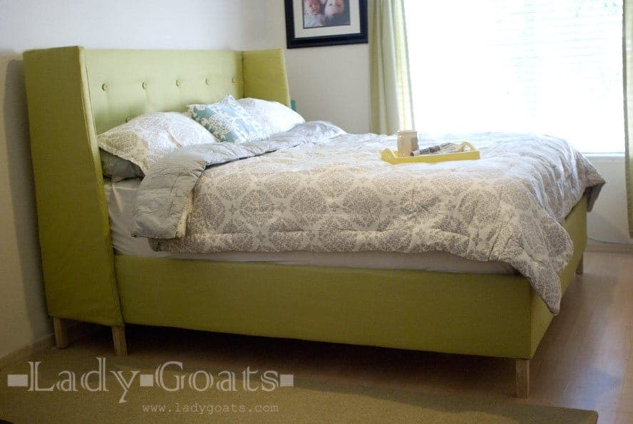 California king platform bed with a winged, upholstered headboard