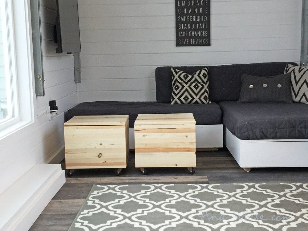 Rolling storage stool with an upholstered lift-off cushion top