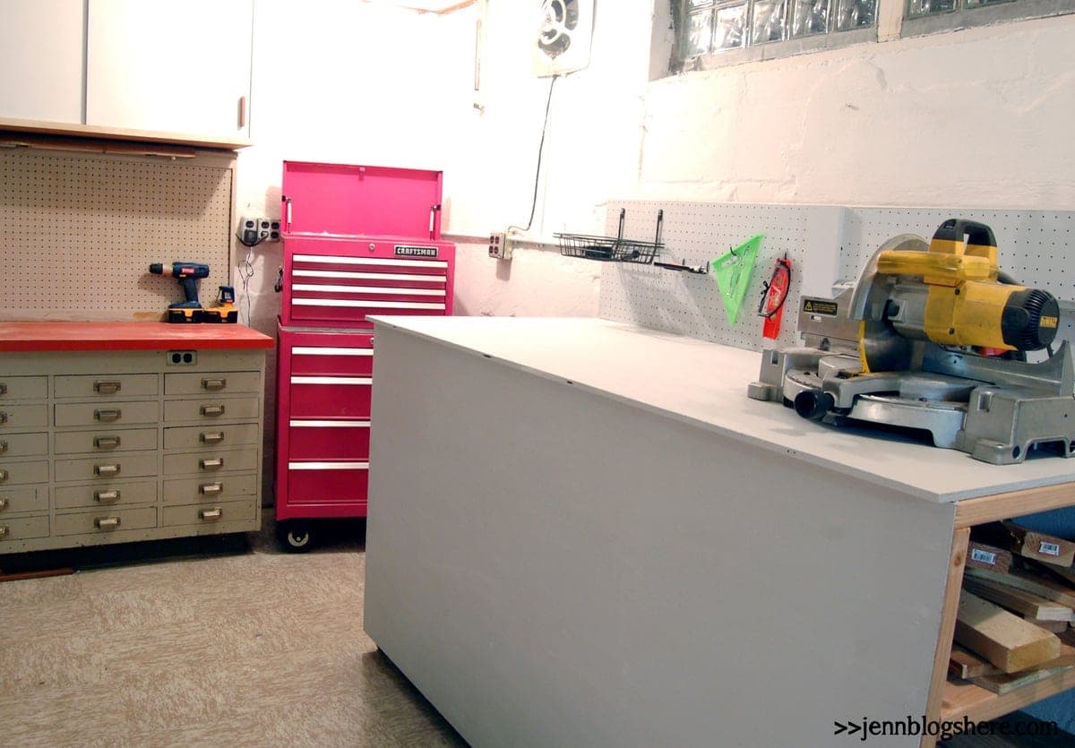 Rolling enclosed workbench with open lumber storage shelves