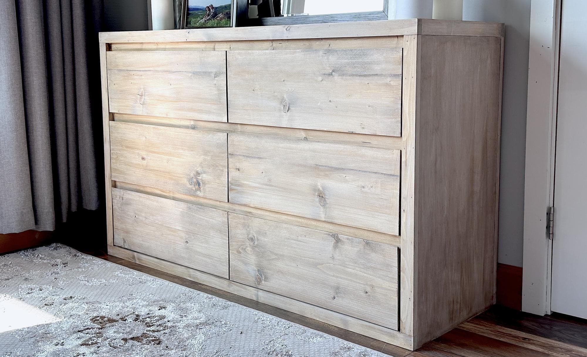 Minimalist six-drawer modern dresser with beveled plank drawer faces