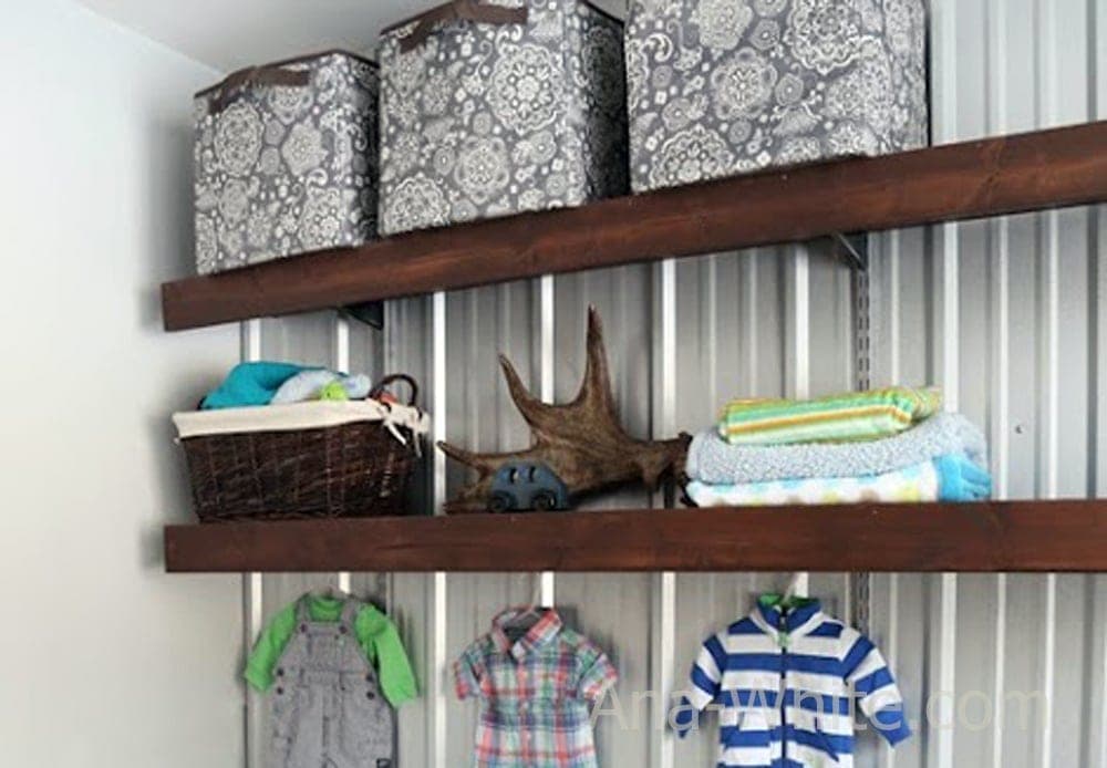 Solid wood shelf covers installed over wire shelving brackets